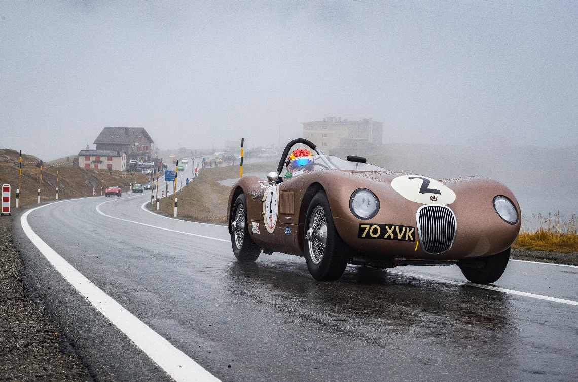 The JD Classics C-Type of Chris Ward pulls away from the start point in the first of four timed runs up the Bernina Pass.