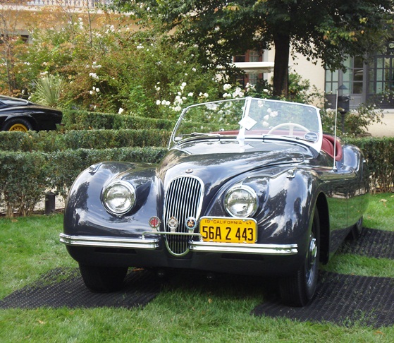 The ex-Clark Gable XK120 on display within the Four Season's vast gardens